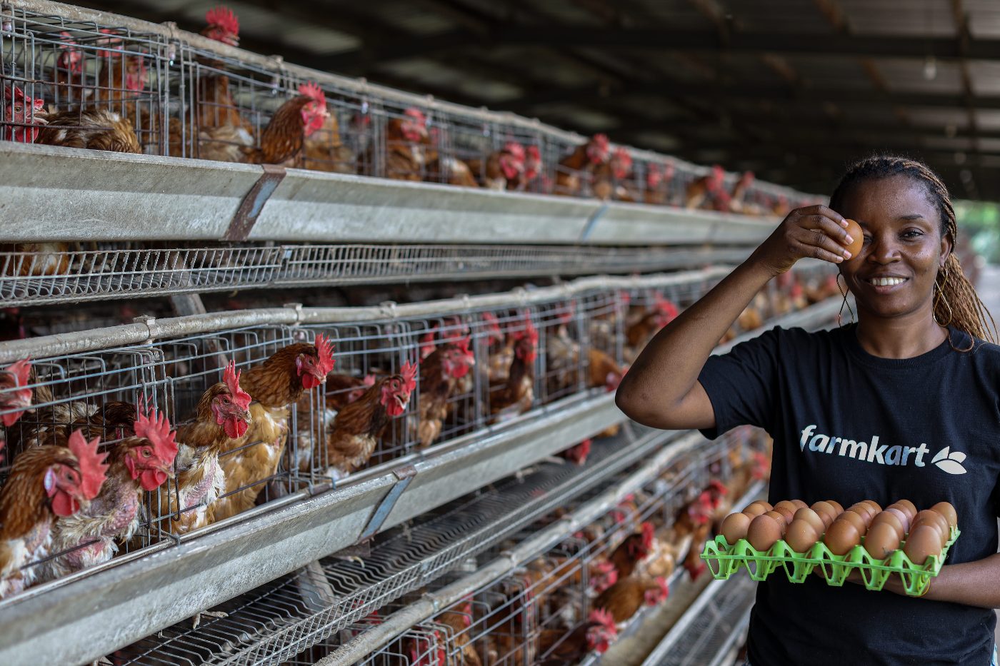 Farmkart team member holding farm-fresh eggs